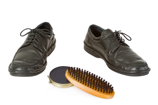 Men's shoes and shoe cerme isolated on white background