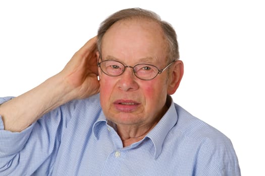 Senior holds it to his ear by the hand