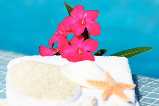 Spa setting with flower and blue water
