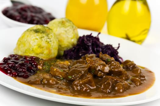 Venison ragout with dumplings,cream,red cabbage,cranberries