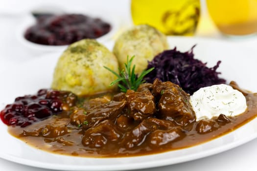 Venison ragout with dumplings,cream,red cabbage,cranberries