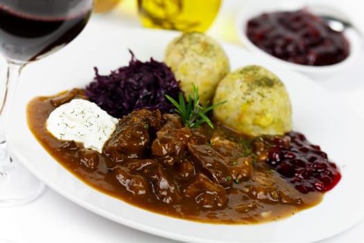 Venison ragout with dumplings,cream,red cabbage,cranberries