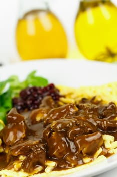 Venison ragout with spaetzle,cream,cranberries,lamb's lettuce