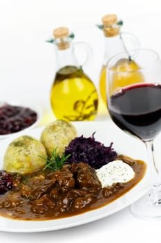 Venison ragout with dumplings,cream,red cabbage,cranberries