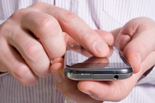 using a smart phone whilst waiting for a business meeting