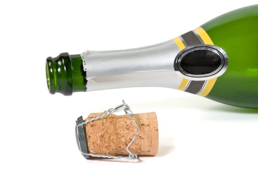 champagne bottle and cork over a white background