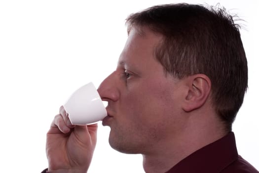 Man drinking an espresso from a cup