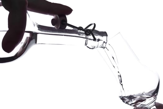 Liquor is poured into a glass