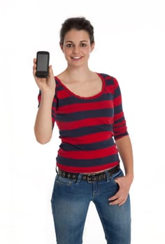 Front view of young woman showing cell phone screen on white background.