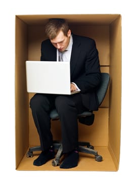 Businessman in a very tight office isolated on white background
