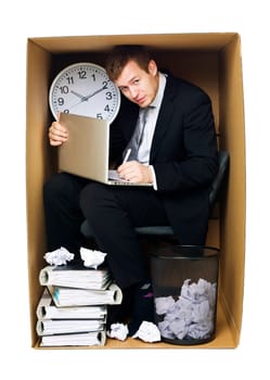 Businessman in a very tight office isolated on white background