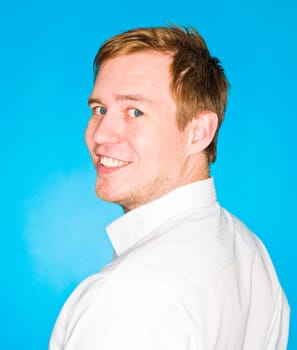 Portrait of a young man on blue background