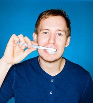 Close up of a man brushing teeths