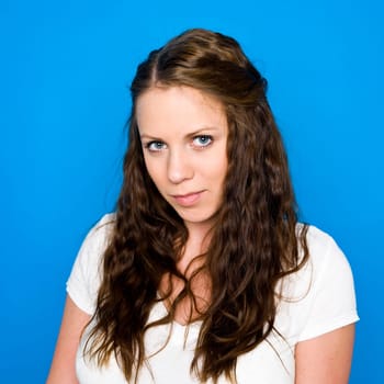 Portrait of a young girl on blue background