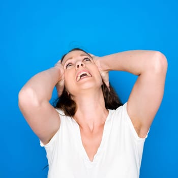 Portrait of a young girl on blue background
