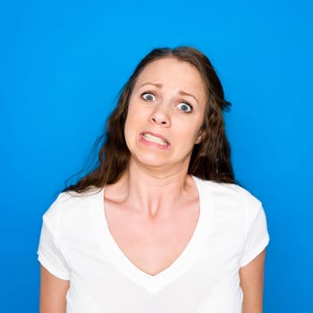 Portrait of a young girl on blue background