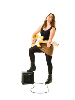Young woman playing electric guitar isolated on white background