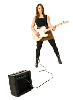 Young woman playing electric guitar isolated on white background