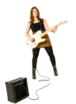 Young woman playing electric guitar isolated on white background