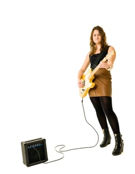 Young woman playing electric guitar isolated on white background
