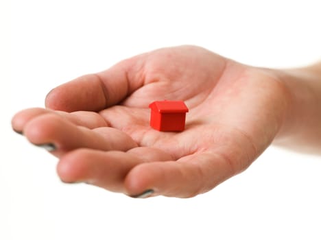 Open hand with Toy house isolated on white background