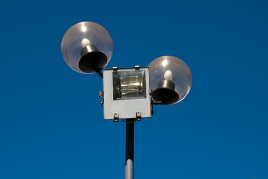 street lamp against a clear blue sky