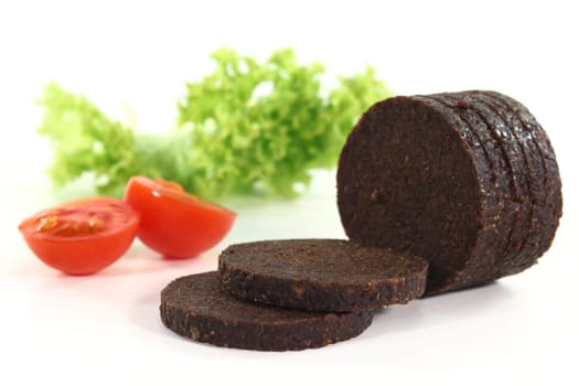 some slices of pumpernickel against white background
