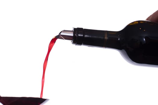 Red wine is poured into a wine glass