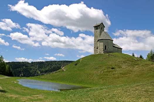 Vigil Chapel with mountain lake