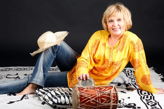 Portrait of attractive woman with drums.