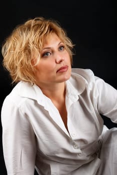 Portrait of a woman sitting on the floor