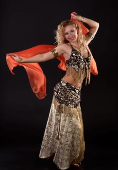 Young blonde belly dancer in black.