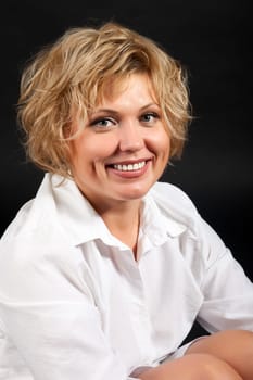 Portrait of a woman sitting on the floor