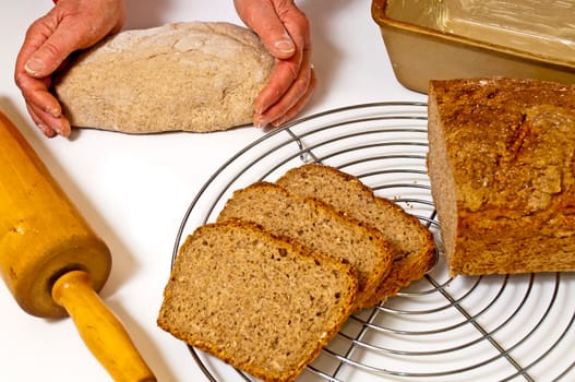 Wholemeal bread with dough and baking pan