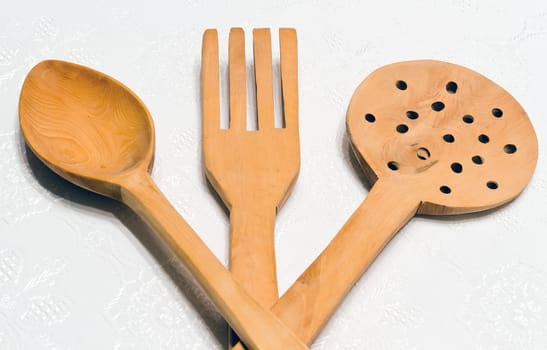 Wooden kitchen utensils set, isolated on white.