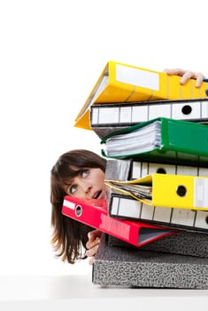 Stressed female office worker with folders. Studio shot, isolated on white background