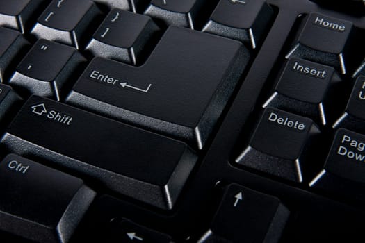 Close up enter key on black computer keyboard