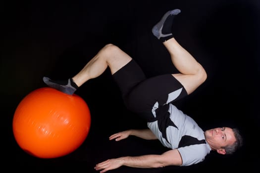 Athlete doing fitness training with the pezzi ball