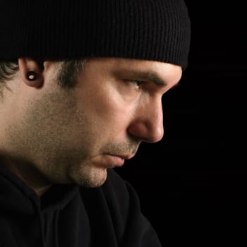 Photo of a suspicious male, possibly a burglar, prowler or thief.
