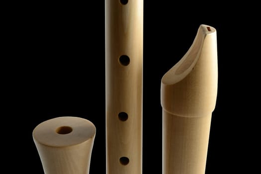 Parts of a wooden recorder made of maple wood