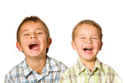 studio shot of two laughing boys
