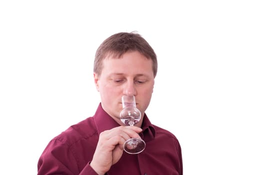 A man smells the scent of a grappa