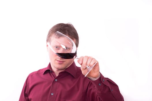 Man visually checks the quality of the wine