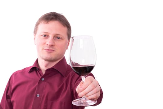 A man tastes a red wine