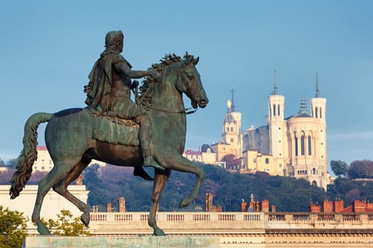 Statue of Louis and Basilique Fourviere on a background