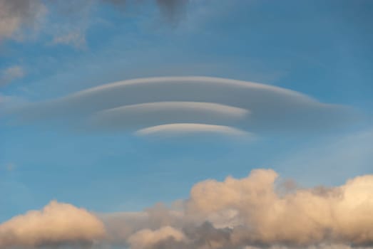 lenticular cloud at sunset in Italy
