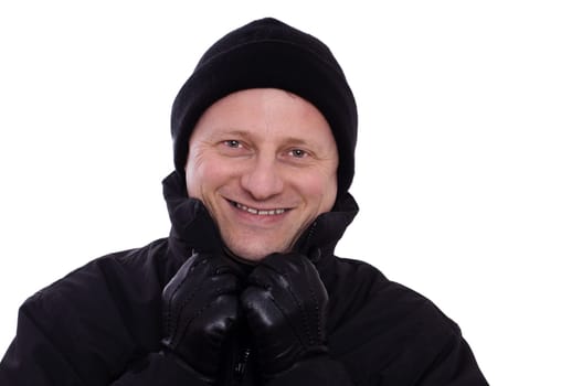 Despite the cold,a man with a hat and gloves laughs