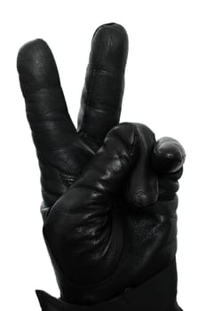 A hand with a glove points two fingers upwards