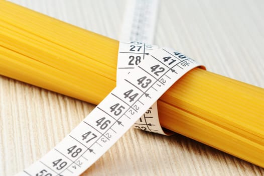 diet concept, Spaghetti with measuring tape
