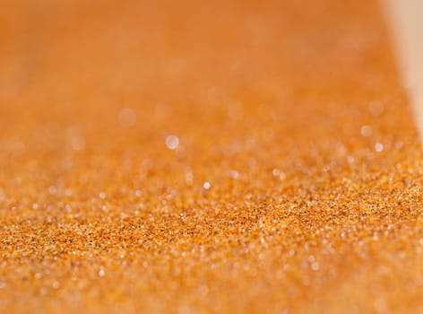 Very shallow depth of field macro photo of sandpaper